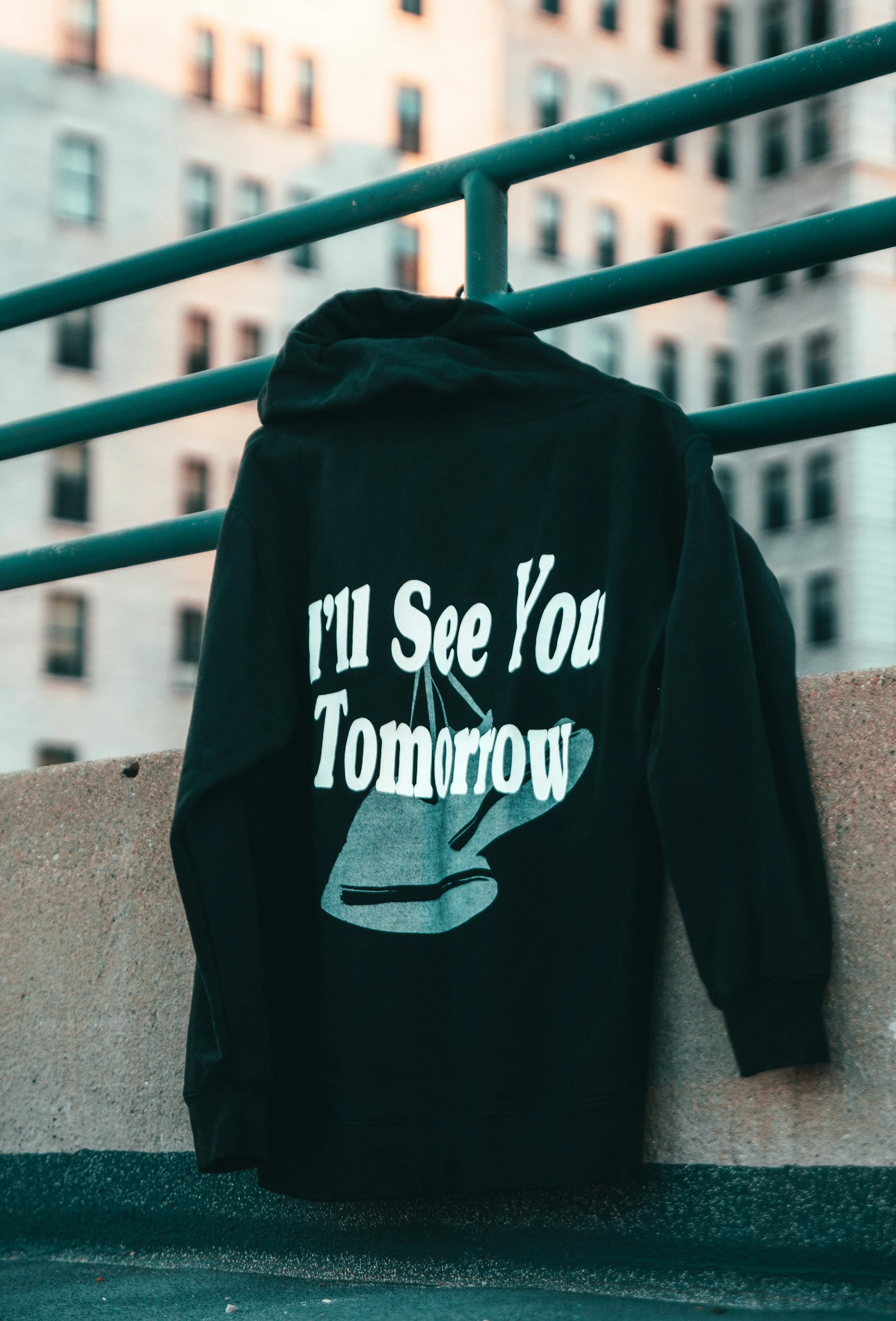 Static Hoodie in washed black, hanging